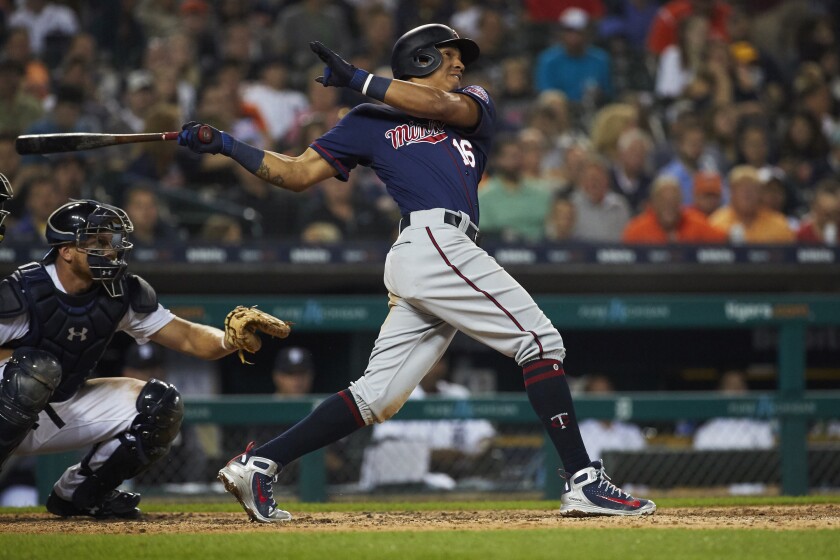 Minnesota Twins shortstop Ehire Adrianza (16) hits a grand slam in the seventh inning against the Detroit Tigers at Comerica Park in Detroit on June 12, 2018. Rick Osentoski / USA TODAY Sports